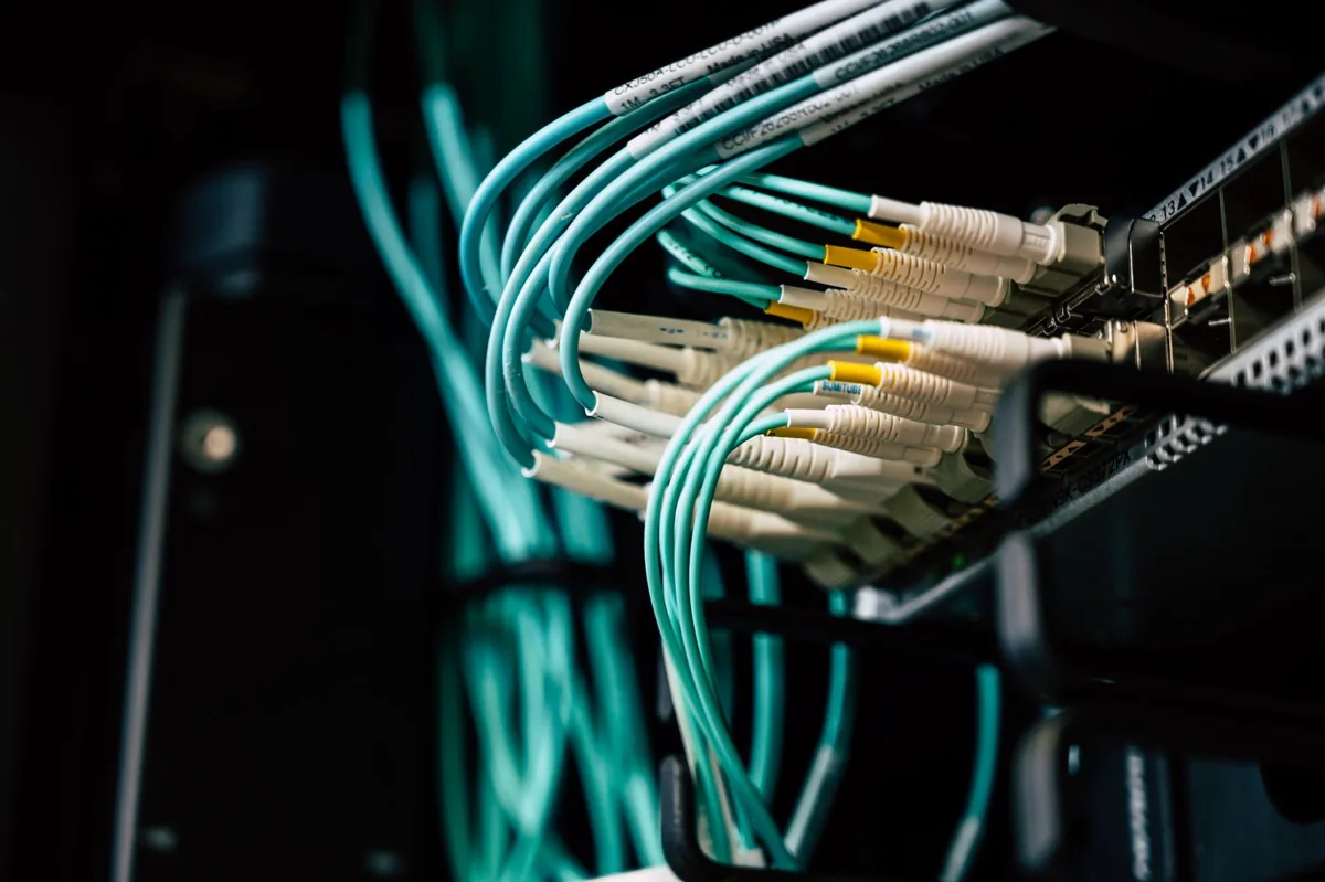 Network switch and connected cables; illustrative infrastructure photograph