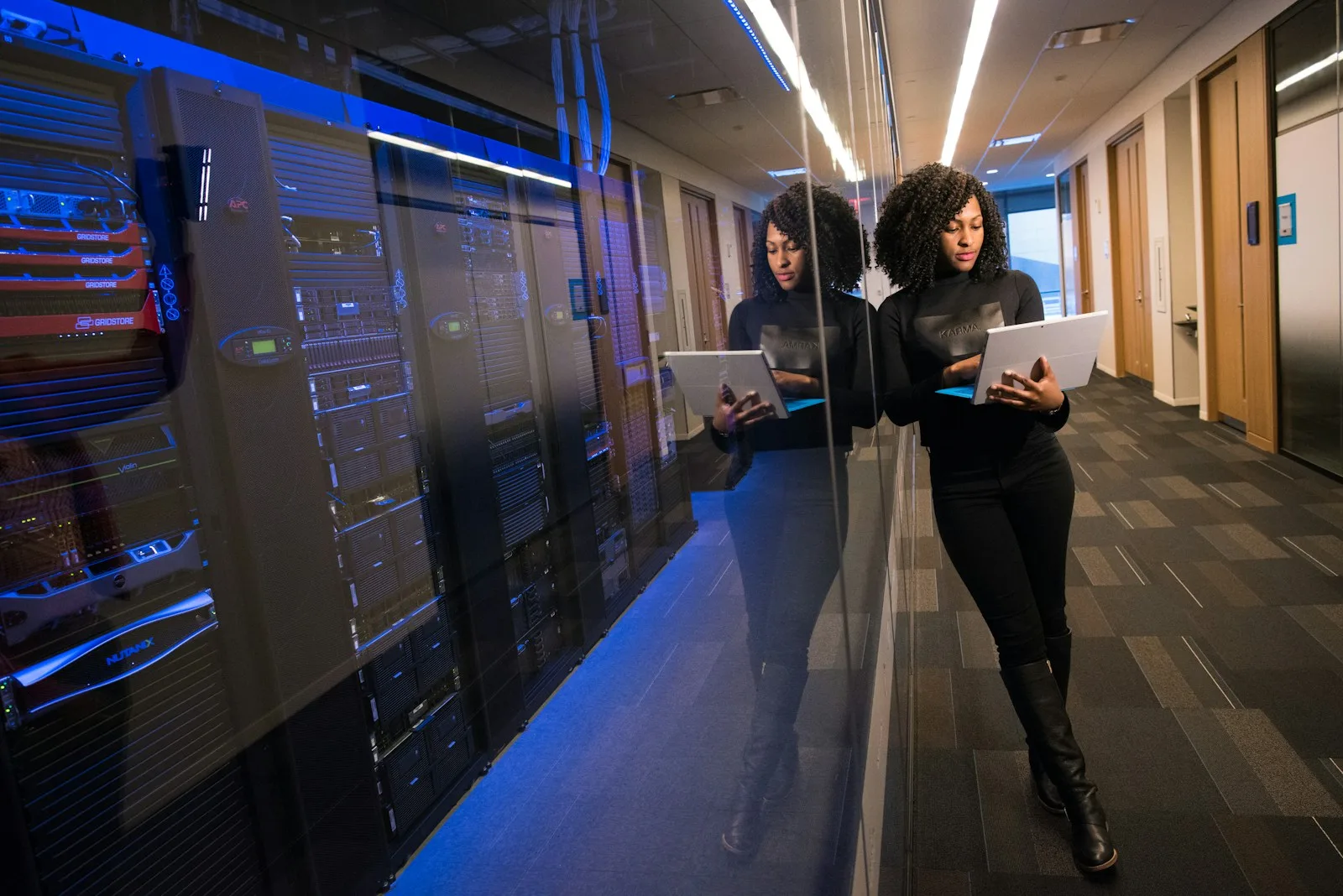 Technology professionals working together at a laptop; illustrative photography